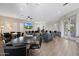 Community lounge with tables, seating, television and light wood flooring at 19550 N Grayhawk Dr # 1144, Scottsdale, AZ 85255