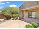 Covered patio features a ceiling fan and desert landscaping at 19550 N Grayhawk Dr # 1144, Scottsdale, AZ 85255