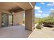 Covered patio with desert landscaping and a ceiling fan at 19550 N Grayhawk Dr # 1144, Scottsdale, AZ 85255