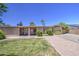 Spacious backyard with lush lawn, gravel area and mature landscaping at 2041 E Des Moines St, Mesa, AZ 85213