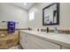 Inviting bathroom boasts double sinks, vanity with countertops and modern fixtures, plus decorative tile at 2041 E Des Moines St, Mesa, AZ 85213