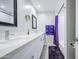 Bright bathroom featuring double sinks, vanity with quartz countertops and modern fixtures, plus shower and tub at 2041 E Des Moines St, Mesa, AZ 85213