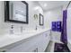 Bright bathroom featuring double sinks, vanity with quartz countertops and modern fixtures, plus shower and tub at 2041 E Des Moines St, Mesa, AZ 85213