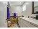 Bathroom featuring double sinks, granite countertop, and decorative backsplash at 2041 E Des Moines St, Mesa, AZ 85213