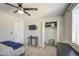 Bedroom with modern lighting, closet space, and neutral tones at 2041 E Des Moines St, Mesa, AZ 85213