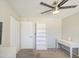 Bedroom boasts a ceiling fan, closet, fresh paint, and carpet creating a modern inviting space at 2041 E Des Moines St, Mesa, AZ 85213