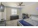 Cozy bedroom featuring modern decor, a ceiling fan, and comfortable furnishings at 2041 E Des Moines St, Mesa, AZ 85213