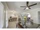 Open concept dining area with modern lighting, stylish furniture, and an open layout at 2041 E Des Moines St, Mesa, AZ 85213