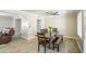 Dining area with modern furniture, a ceiling fan, and a view into the living room at 2041 E Des Moines St, Mesa, AZ 85213