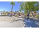 Charming single-story home with desert landscaping, a palm tree, and a welcoming front entrance at 2041 E Des Moines St, Mesa, AZ 85213
