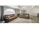 Comfortable living room showcases a vaulted arch window, two sofas, and tile flooring at 2041 E Des Moines St, Mesa, AZ 85213