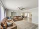 Spacious living room with a ceiling fan and tile floors at 2041 E Des Moines St, Mesa, AZ 85213