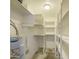 Bright pantry with ample shelving for convenient and organized storage at 2041 E Des Moines St, Mesa, AZ 85213