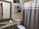 Bathroom with vanity, mirror, neutral walls and patterned shower curtain at 2101 S Meridian Rd # 437, Apache Junction, AZ 85120