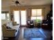 Cozy living room featuring a comfortable sofa, natural lighting, and a view of the patio doors at 2101 S Meridian Rd # 437, Apache Junction, AZ 85120