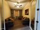 Living room with neutral walls, hardwood floors, comfortable sofas, and natural lighting through the windows at 2101 S Meridian Rd # 437, Apache Junction, AZ 85120