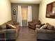 Comfortable living room featuring hardwood floors, neutral-toned walls, and plush seating arrangements under natural light at 2101 S Meridian Rd # 437, Apache Junction, AZ 85120