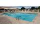 Community pool is fenced in for privacy with ample seating for residents and guests at 2101 S Meridian Rd # 437, Apache Junction, AZ 85120