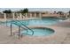 Enjoy the community pool and hot tub with accessibility rails on a sunny day at 2101 S Meridian Rd # 437, Apache Junction, AZ 85120