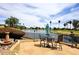 Enjoy the water view from the backyard with a wrought iron fence and patio at 21609 N 61St Ave, Glendale, AZ 85308