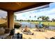 Tranquil backyard oasis showcasing a serene lake view and comfortable seating for relaxing and enjoying the outdoors at 21609 N 61St Ave, Glendale, AZ 85308