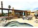 Inviting backyard featuring a pool, patio with a pergola, stylish seating, and mature landscaping creating an ideal space for relaxation at 21609 N 61St Ave, Glendale, AZ 85308