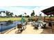 Relaxing outdoor space featuring a lake view, comfortable seating, and a charming water feature at 21609 N 61St Ave, Glendale, AZ 85308