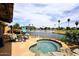 Enjoy this backyard with a private spa overlooking a lake and golf course at 21609 N 61St Ave, Glendale, AZ 85308