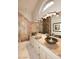 Bright bathroom featuring dual sinks, granite counters, neutral cabinetry, and a walk-in shower with tile surround at 21609 N 61St Ave, Glendale, AZ 85308