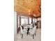 Charming dining area features knotty wood ceilings, brick accents and views of the backyard at 21609 N 61St Ave, Glendale, AZ 85308
