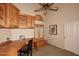 Dedicated home office featuring custom built-ins, a desk, and a ceiling fan at 21609 N 61St Ave, Glendale, AZ 85308