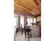 Charming kitchen featuring knotty wood cabinets, brick accents and a granite topped breakfast bar at 21609 N 61St Ave, Glendale, AZ 85308