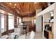 Charming kitchen featuring knotty wood cabinets, brick accents and a granite topped breakfast bar at 21609 N 61St Ave, Glendale, AZ 85308