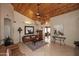 Spacious living room with vaulted wood ceilings, tile floors, and an open layout at 21609 N 61St Ave, Glendale, AZ 85308