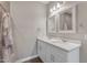 Bright bathroom with double sink vanity, granite countertop, and updated fixtures at 2215 W Highland Ave, Phoenix, AZ 85015