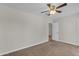 Bedroom featuring neutral walls, plush carpet, and a ceiling fan for comfortable living at 2215 W Highland Ave, Phoenix, AZ 85015