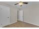 Bedroom features neutral walls, plush carpet, and two closets offering ample storage space at 2215 W Highland Ave, Phoenix, AZ 85015