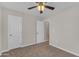 Bedroom features neutral walls, plush carpet, and two closets offering ample storage space at 2215 W Highland Ave, Phoenix, AZ 85015