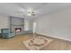 Living room featuring a gray brick fireplace and neutral decor at 2215 W Highland Ave, Phoenix, AZ 85015
