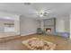Open living area with fireplace, neutral paint, and light-colored wood floors at 2215 W Highland Ave, Phoenix, AZ 85015