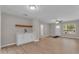 Open living area with light wood floors, a ceiling fan, lots of natural light, and neutral walls at 2215 W Highland Ave, Phoenix, AZ 85015
