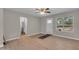 Bright and airy living room showcasing hardwood floors and a white front door with window at 2215 W Highland Ave, Phoenix, AZ 85015