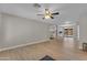 Bright, open living room featuring light wood floors and a ceiling fan at 2215 W Highland Ave, Phoenix, AZ 85015
