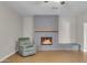 Living room with gray brick fireplace and neutral walls at 2215 W Highland Ave, Phoenix, AZ 85015
