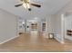 Spacious open-concept living room with hardwood floors and a view of the dining area and backyard at 2215 W Highland Ave, Phoenix, AZ 85015