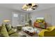 Inviting living room with plush seating, hardwood floors, and contemporary decor, creating a cozy and stylish space at 2215 W Highland Ave, Phoenix, AZ 85015
