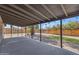 Covered back patio with string lights offers a serene outdoor space at 2215 W Highland Ave, Phoenix, AZ 85015