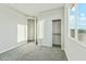 Bright bedroom featuring a closet and a window with outdoor view at 22351 S Manzanilla Rd, Buckeye, AZ 85326
