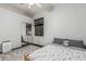 This bedroom features natural light, a patterned rug, bed frame, ceiling fan, and sliding closet doors at 2330 E Stephens Pl, Chandler, AZ 85225
