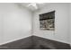Bright bedroom featuring wood floors, window, and neutral paint at 2330 E Stephens Pl, Chandler, AZ 85225